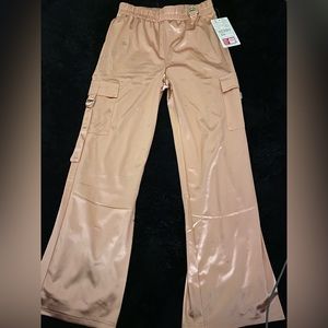 Silky in-and-out lined pants with a unique belt loop and spacious pockets.